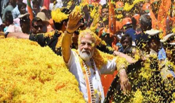 BJP’s road show : PM accorded rousing reception, greets party cadres by waving hands