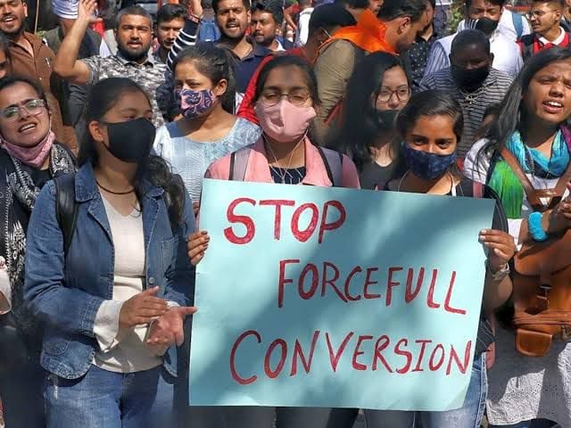 Would a law against forced religious conversions be considered to be a just war?