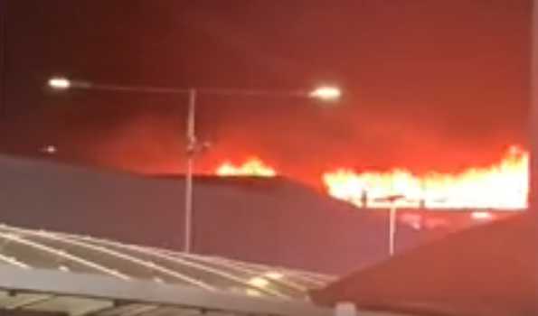 London Luton airport suspends flights after fire engulfs car park