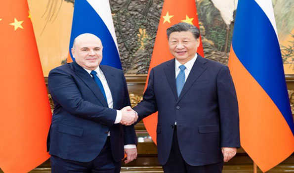 Xi meets with Russian PM