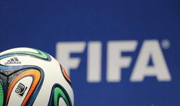 FIFA President Gianni Infantino and football players at a FIFA event, with a focus on FIFA's increased investment in football development to 2.25 billion USD