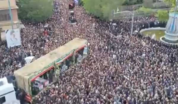 People in Iran’s capital bid farewell to late president